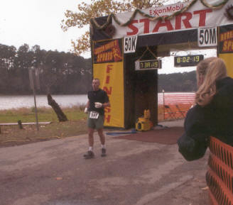 Mark Nelson finishes the 50K, hurt knee and all.